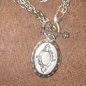 Signed Locket charm holder with heart detail and toggle clasp Silvertone Classy
